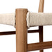 Wood post with vintage white woven cord wrap on an outdoor bar counter stool
