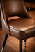 Detailed Oxford Club Chair by Social Design Supply Co: A classic hospitality lounge chair with supportive cushioning and soft upholstery for restaurants