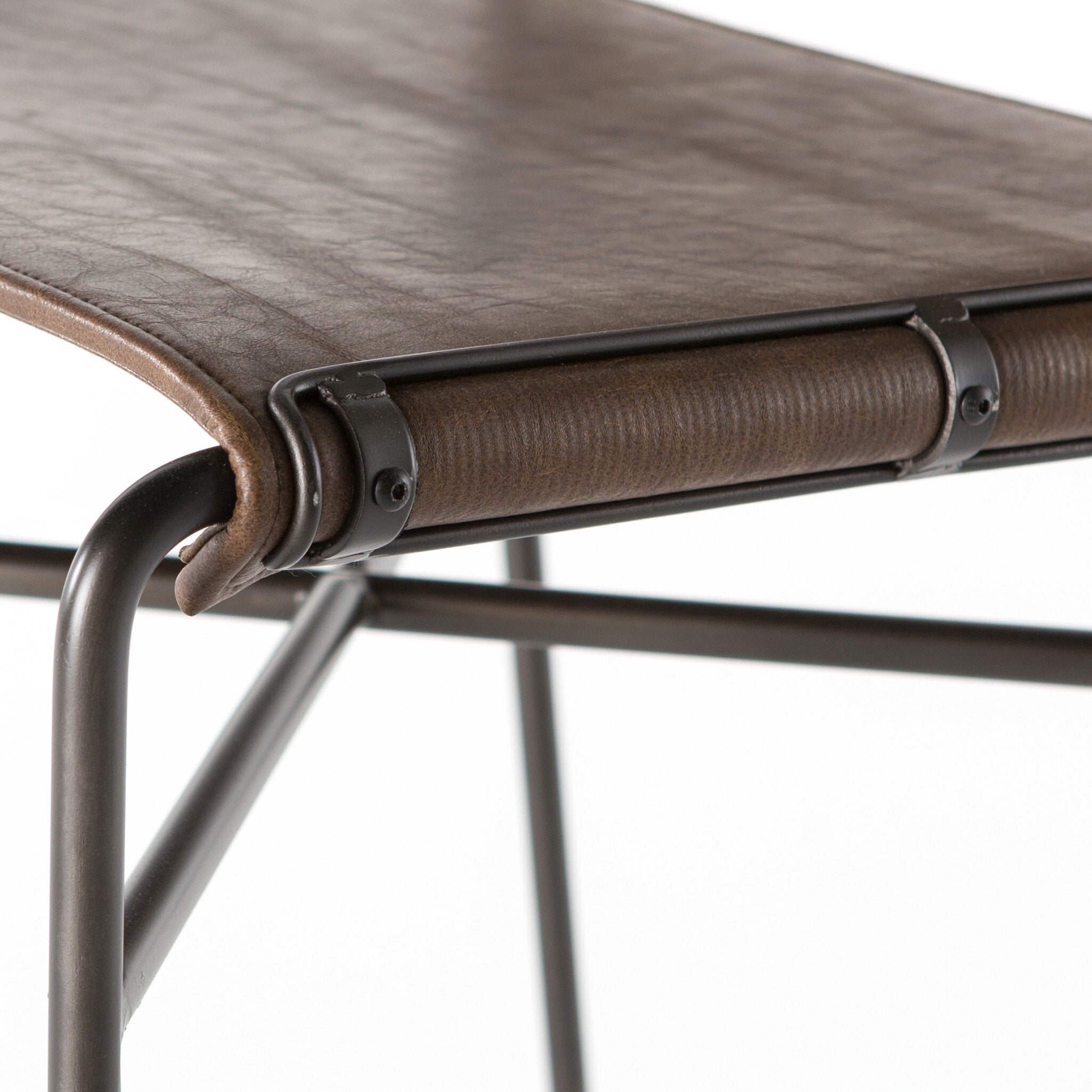 Detailed view Wharton Counter Stool featuring Distressed Brown faux leather and industrial steel legs