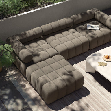 Dining Scene A modern three-piece outdoor sectional sofa with tufted backrest and seat cushions, atop a teak wood base, in a neutral color.