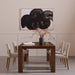 Armless dining chair set with light camel upholstery and wooden legs at a dining table.