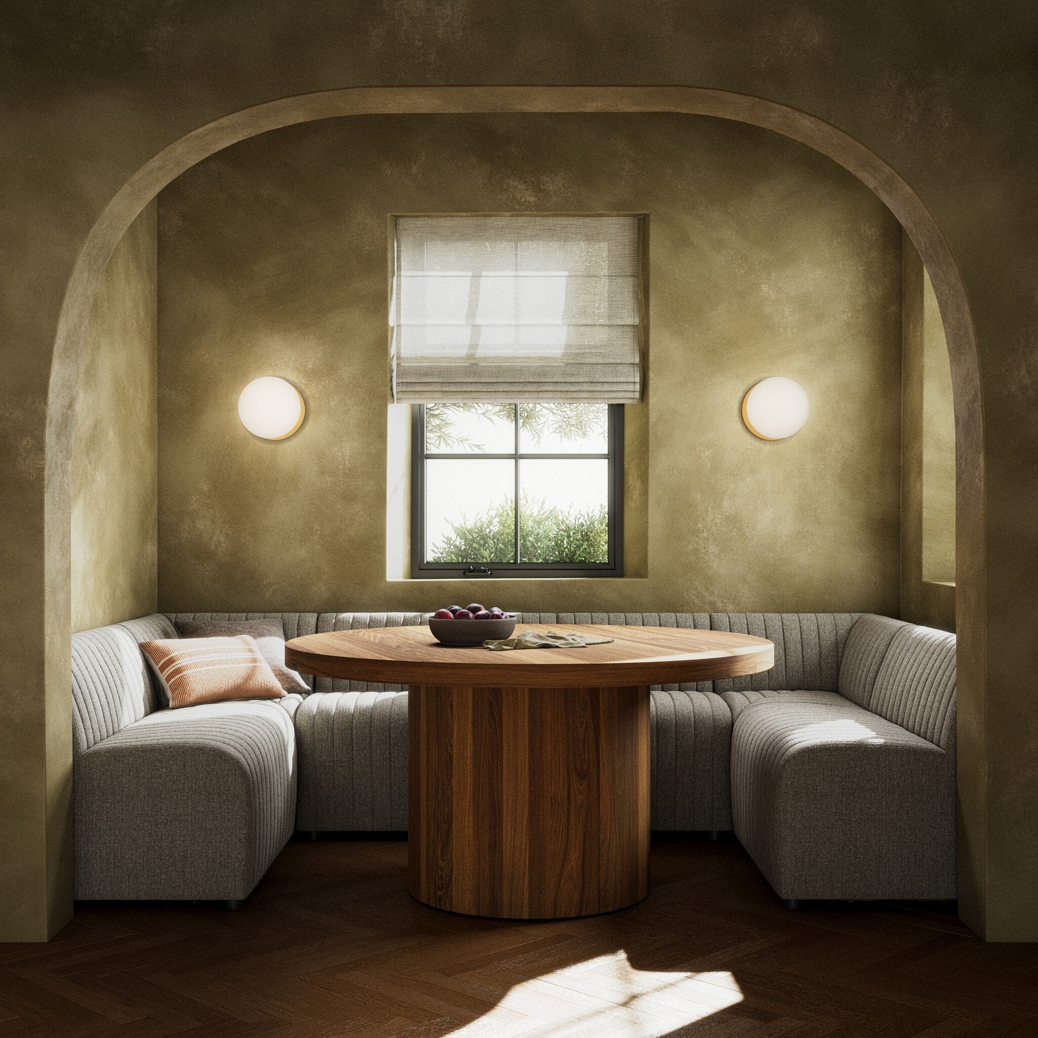 Dining scene Augustine 119.5-inch U-shape Dining Banquette by Four Hands in grey herringbone performance fabric with dramatic vertical channel tufting