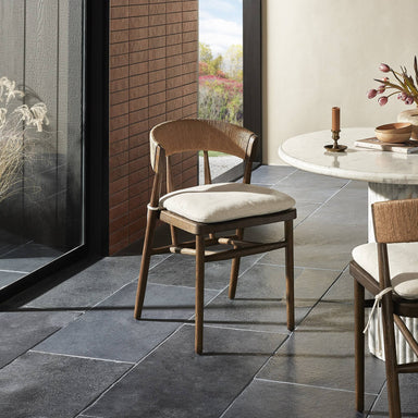 Dining scene Buxton Armless Dining Chair in solid oak with a hand-wrapped paper rush back and Savile Flax seat