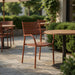 Zurich arm chair in terracotta with perforated seat and back, curved armrests