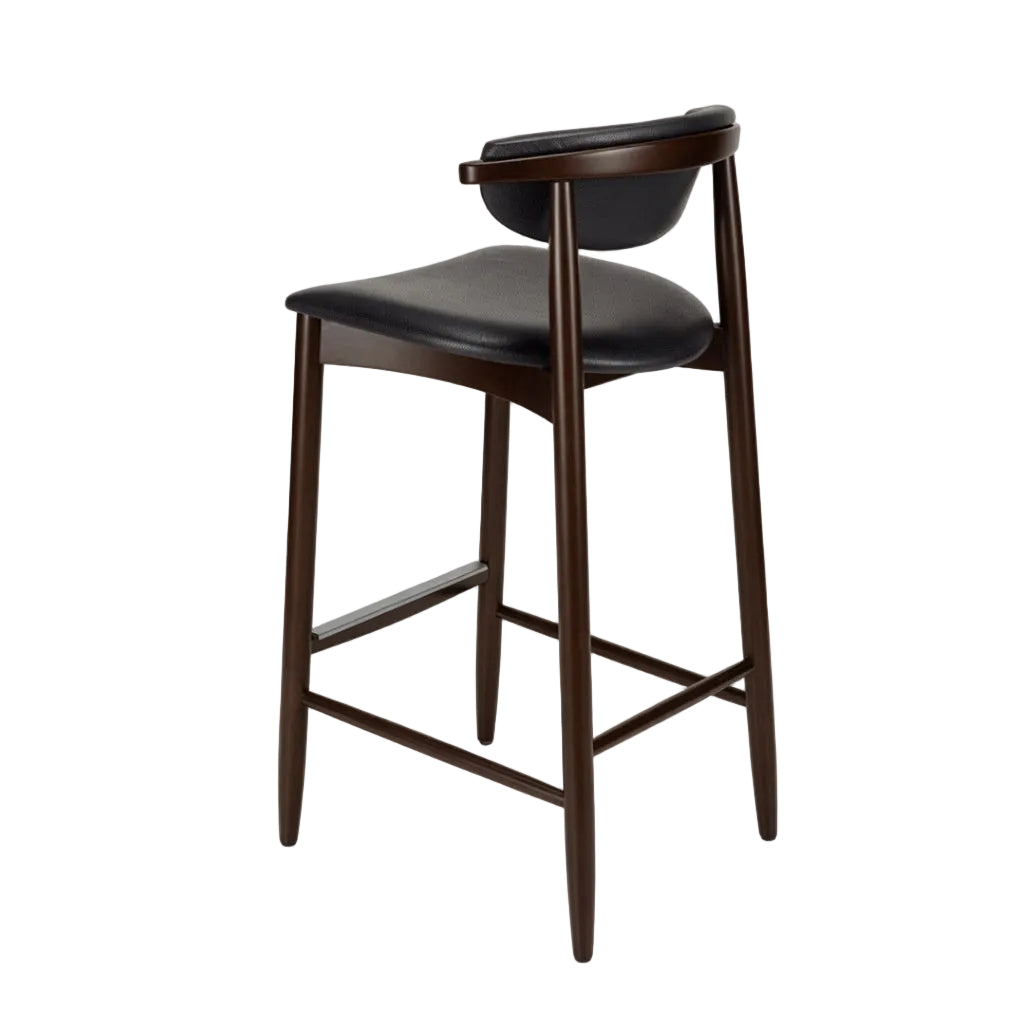 Bar stool with black upholstered seat and curved back, dark wood legs and footrest