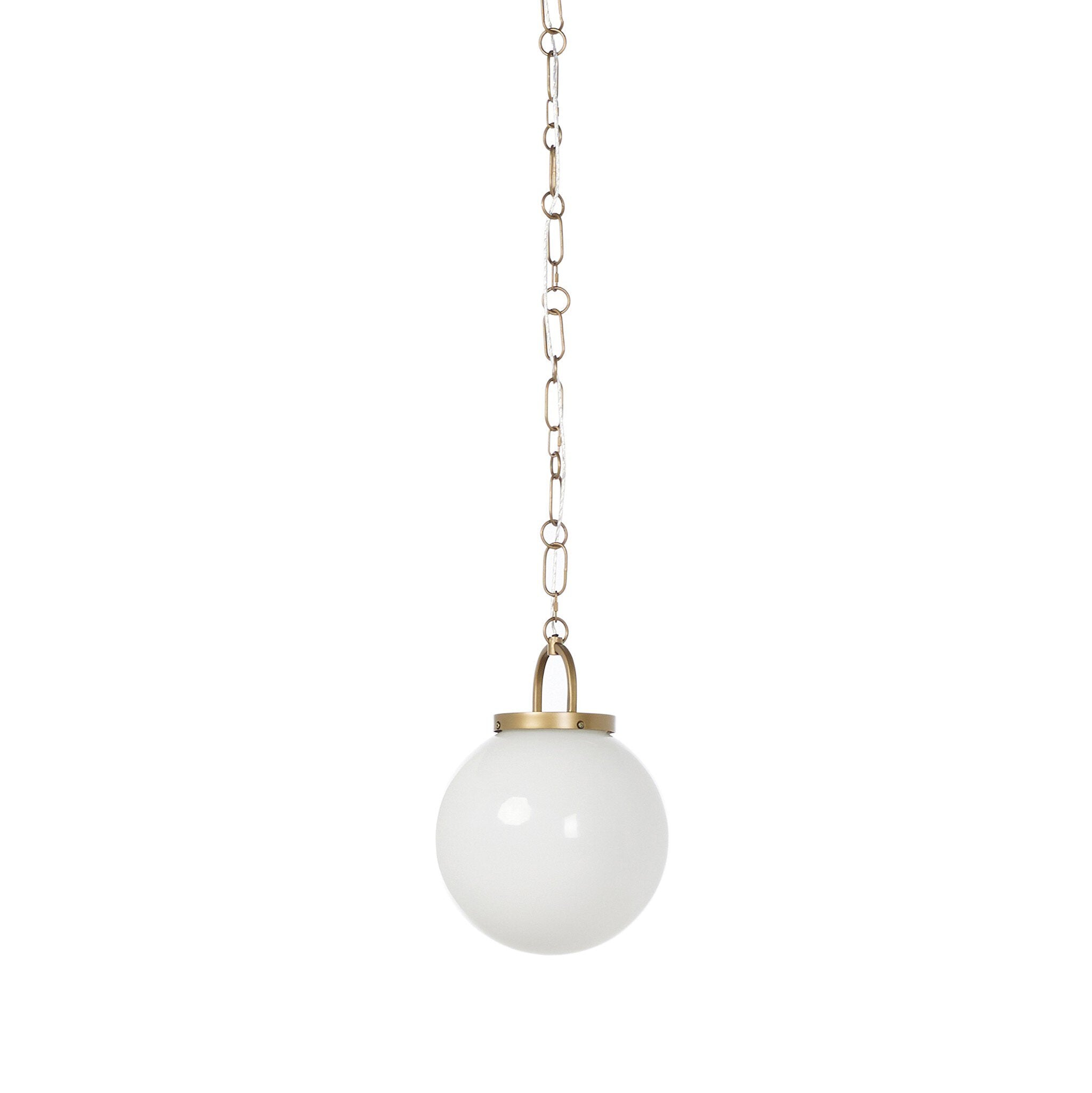 Evelie soft modern pendant light with hand-blown white glass globe and antique brass fixture chain for dining room or entryway on a white background
