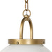 Evelie soft modern pendant light with hand-blown white glass globe and antique brass fixture chain close up detail
