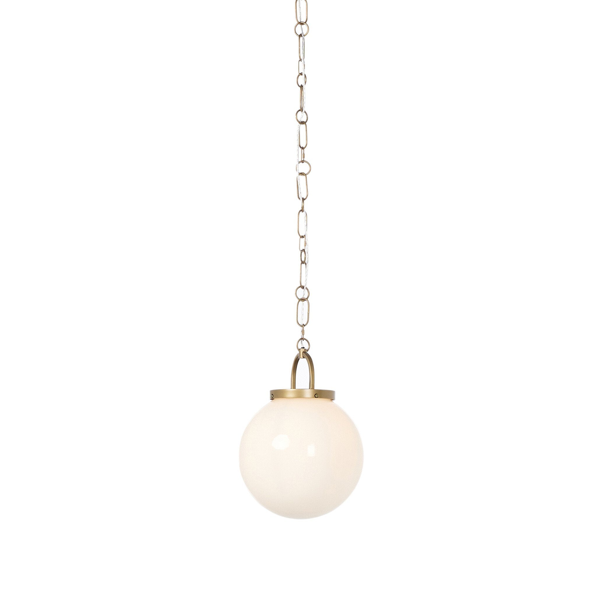 Evelie soft modern pendant light with hand-blown white glass globe and antique brass fixture chain for dining room or entryway on a white background