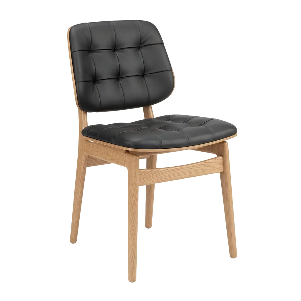 Sutton side chair with black button-tufted upholstery and light natural wood frame