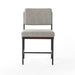 Gray upholstered chair with wooden legs on a white background. Benton Dining Chair in Savile Flannel performance fabric featuring a slim iron frame and wood bar.