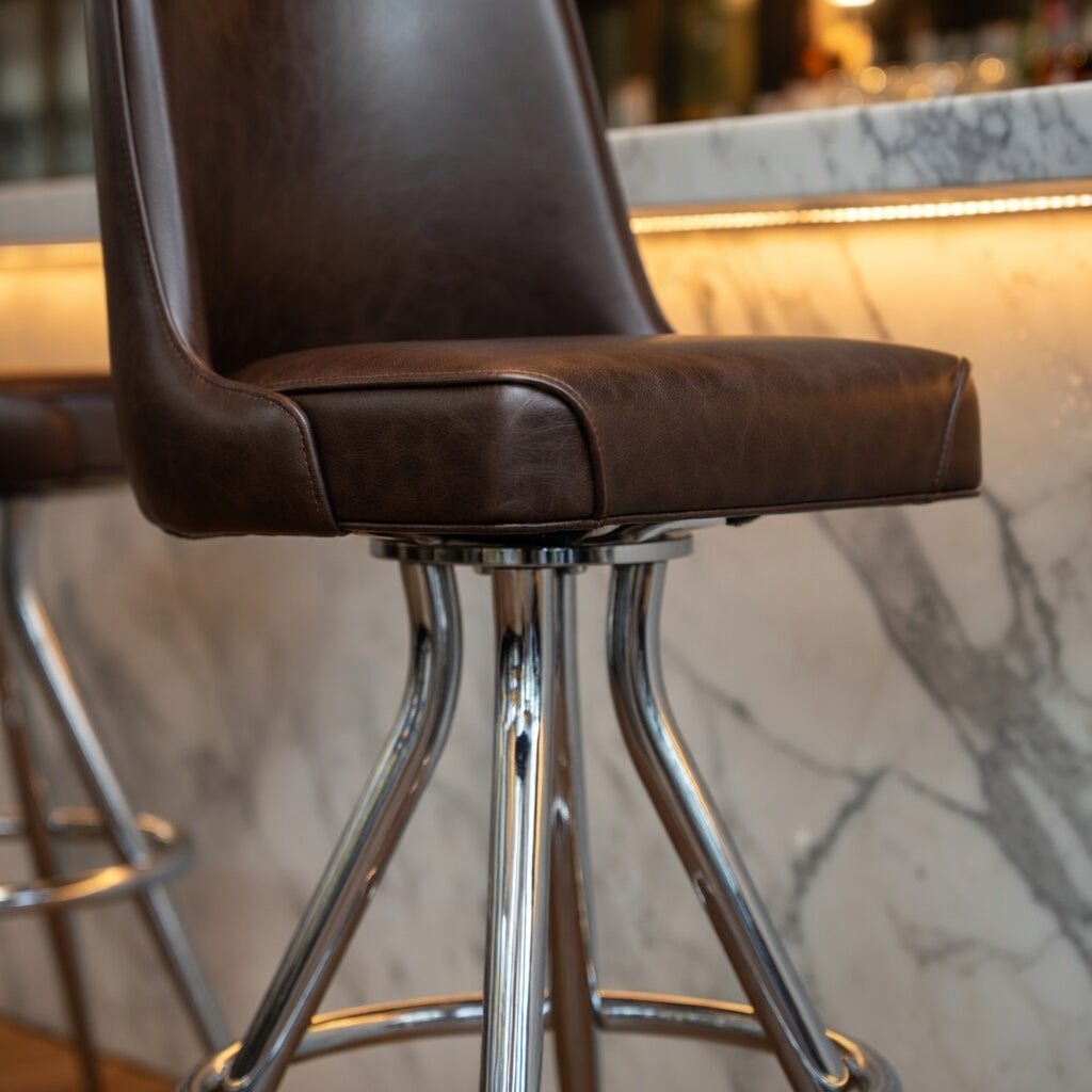 Fudge Brown Close-up of the Camden bucket stool's ergonomic seat and reinforced frame designed for steady commercial movement