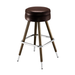 Brown upholstered bar stool with round padded seat, chrome footrest, brass legs