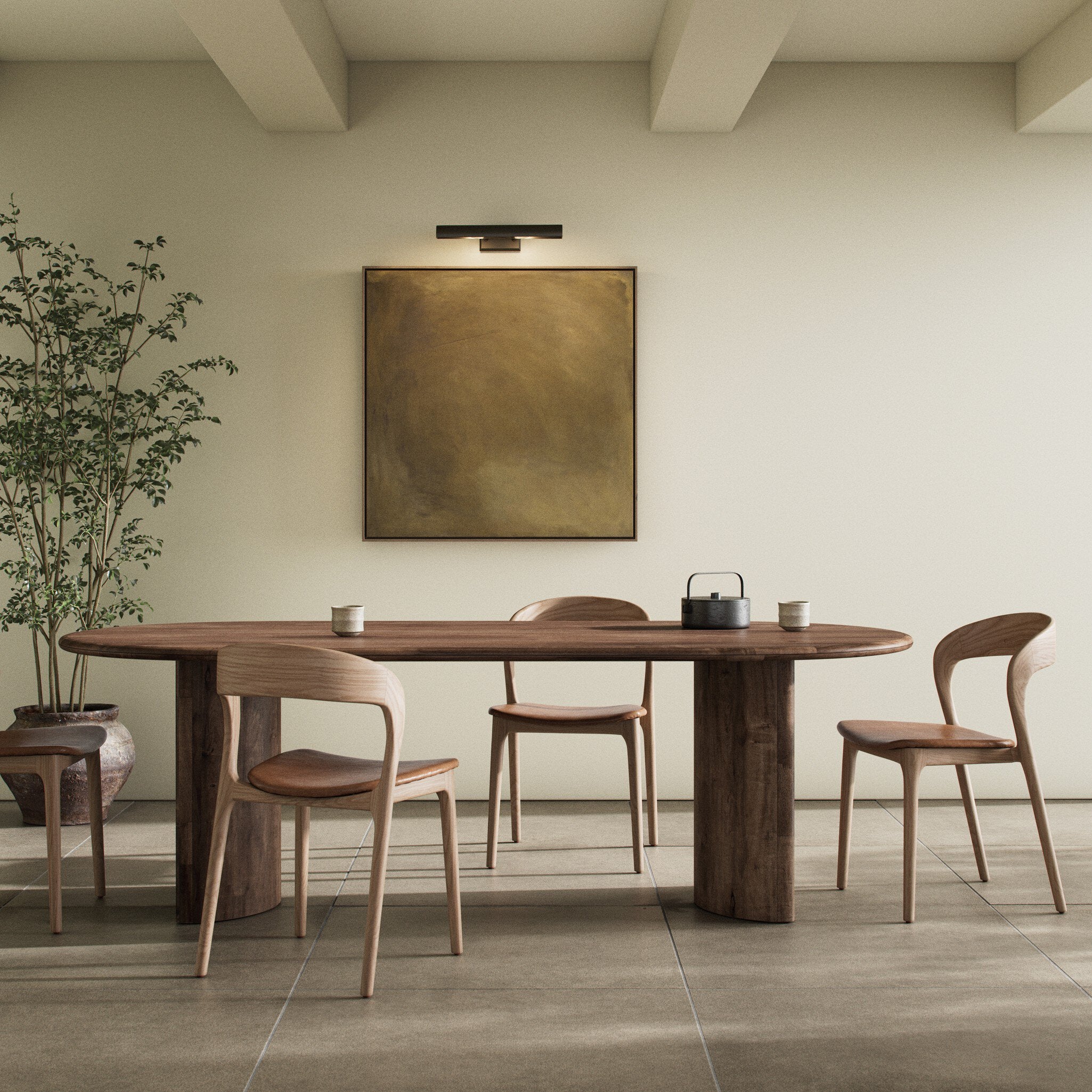 Full dining room Paden Dining Table in Seasoned Brown Acacia with crescent-shaped legs and an oval tabletop