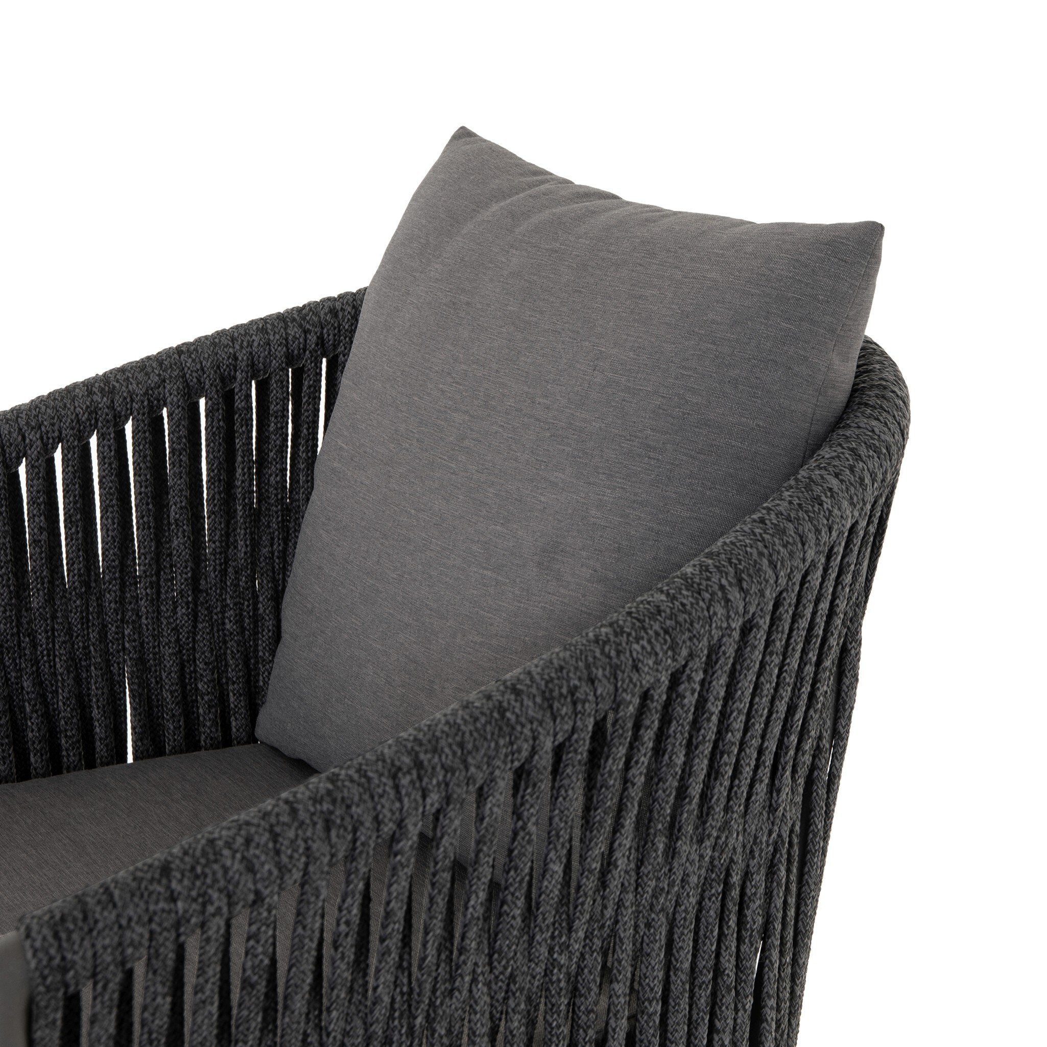 Gray cushion on a textured chair with a white background