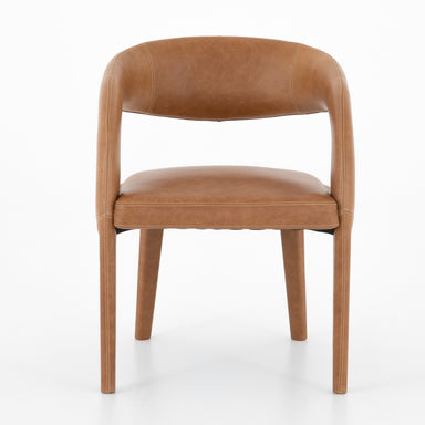 Brown leather chair on a white background. Hawkins Dining Chair in Sonoma Butterscotch top-grain leather with a sculpted open-back frame.
