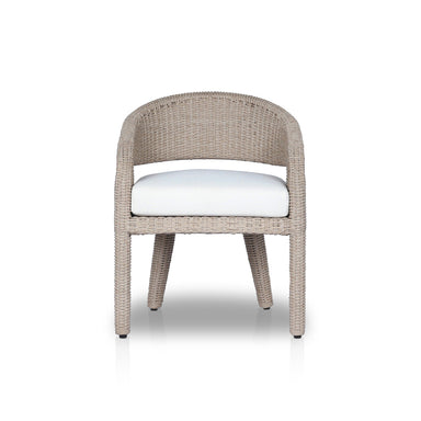 Hawkins Outdoor Dining Chair in Faye Cream with a barrel-back cutout and woven frame