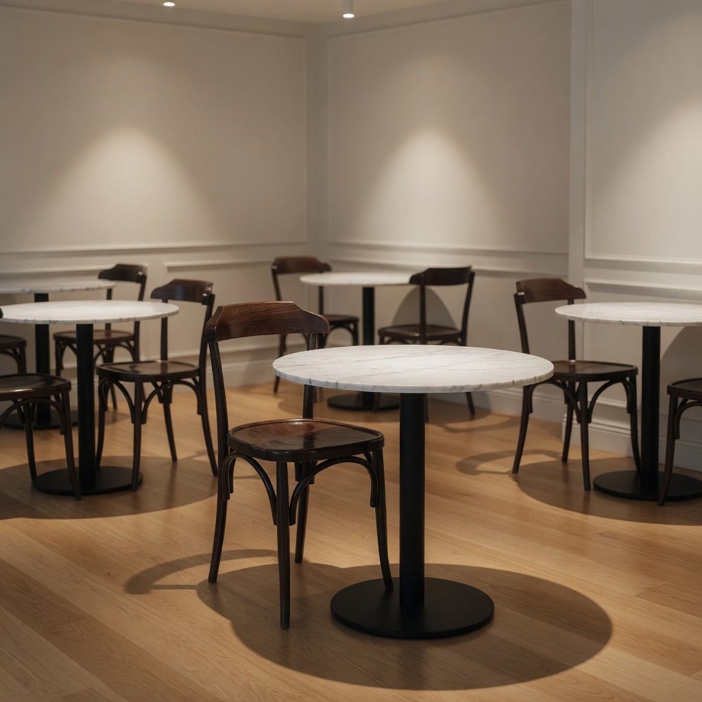 Hazelyn side chair with round dark wooden seat, curved back, and four slender legs.