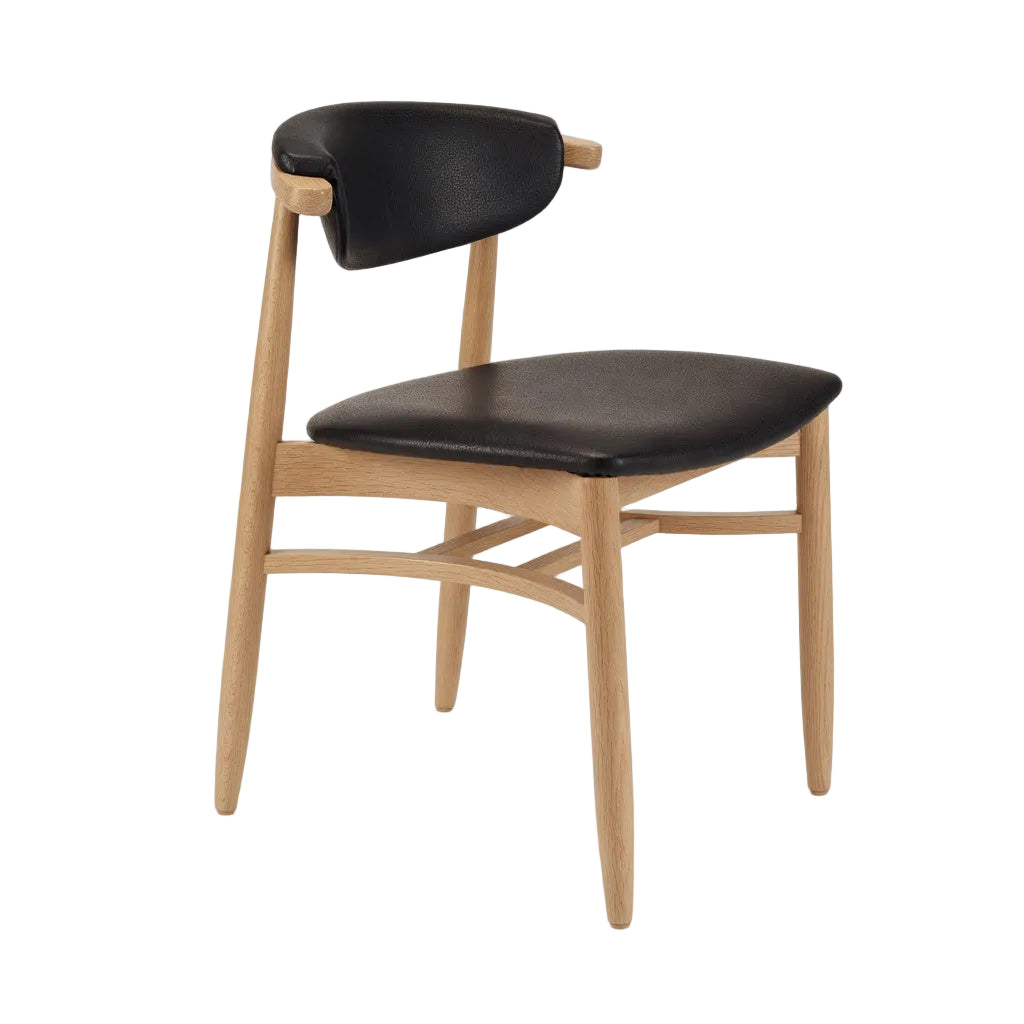 Natural wood side chair with black upholstered seat and curved backrest, angled view
