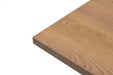 Close-up of ash table top edge showing natural wood grain and smooth surface