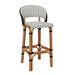 Rattan bar stool with rounded back, white woven cushion with black pattern, light wood base