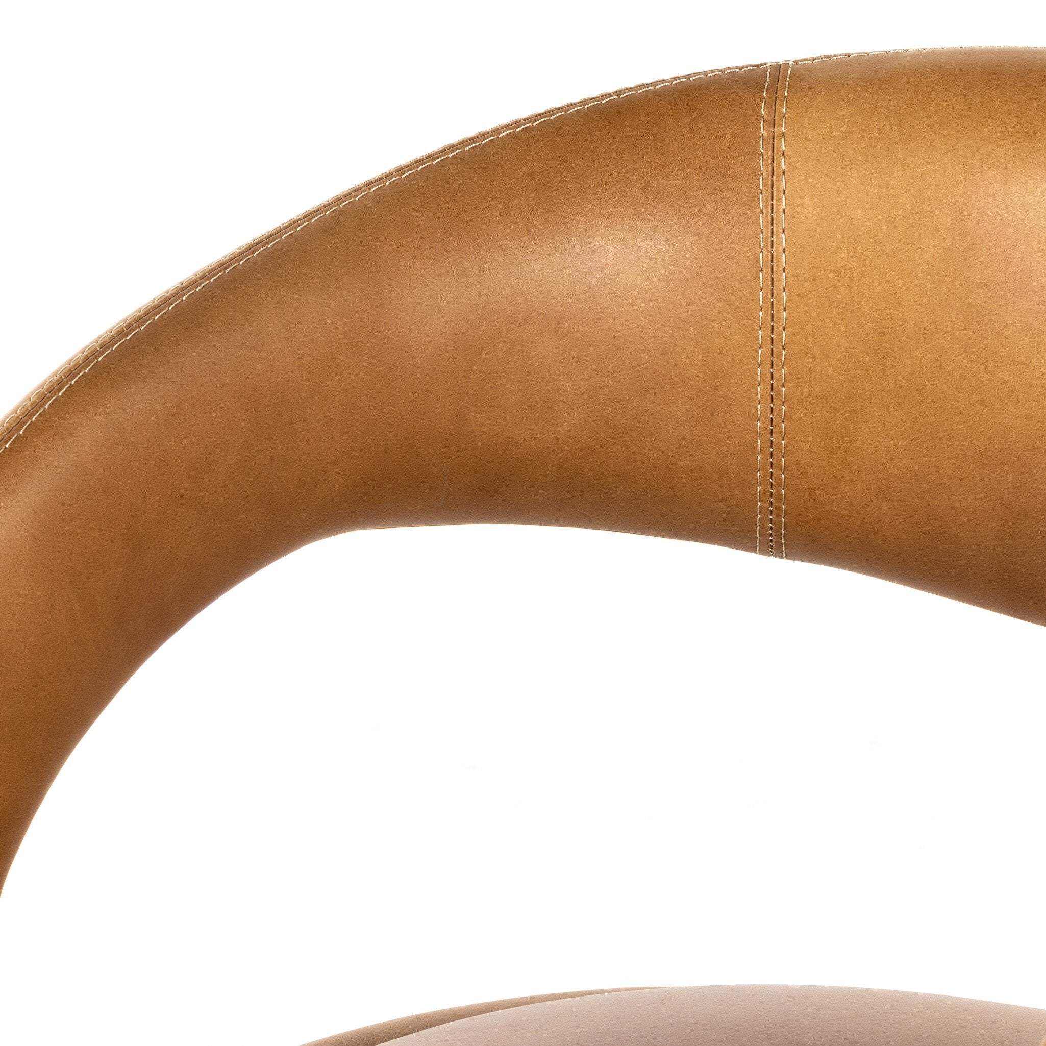Counter stool close-up of tan upholstered backrest curve with visible stitching seams.