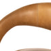 Counter stool close-up of tan upholstered backrest curve with visible stitching seams.