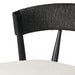 Bar stool close-up of black woven back and cream upholstered seat