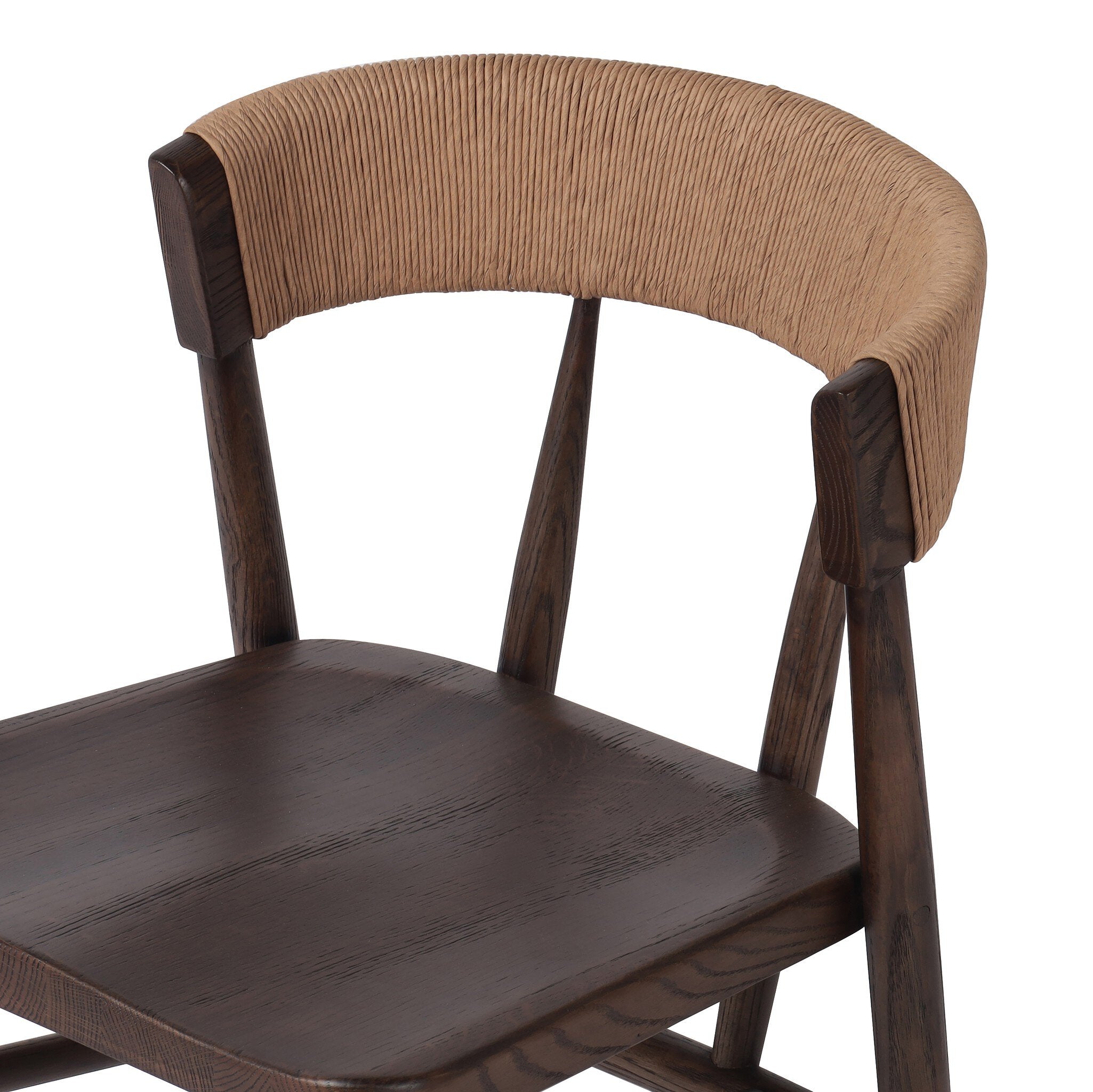 Inner detailing A solid oak dining chair with a paper rush wrapped detail on the back, tapered legs, and a dark finish.