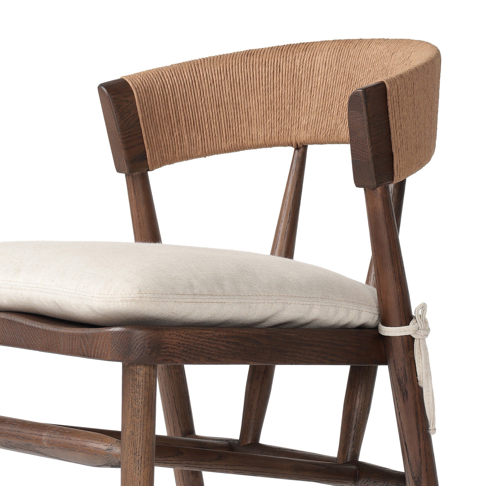 Inner seat detailing Buxton Armless Dining Chair in solid oak with a hand-wrapped paper rush back and Savile Flax seat