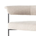 Upholstered counter stool close view: light camel fabric seat with black metal frame