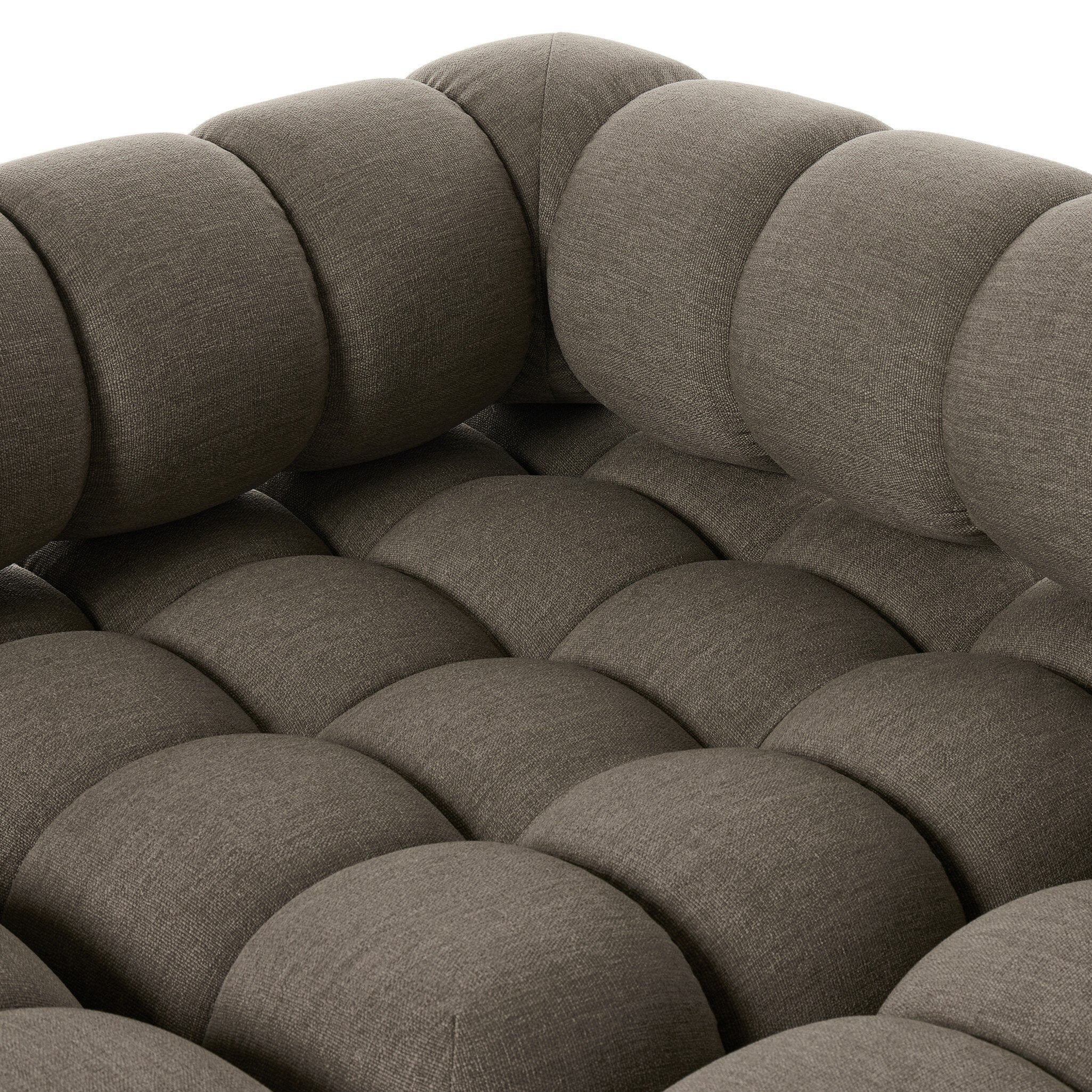 Outdoor sectional sofa in Alessi Fawn close-up of quilted, rounded seat cushions