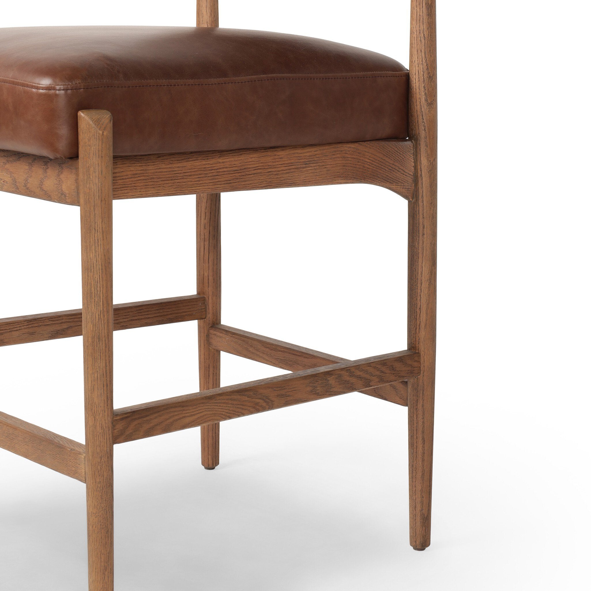 Jazelle Armless Bar Counter Stool Shearling Bolster Back and Oak Wood Frame with Brown Leather Seating Design Idea Retro Mid Century Modern Angle View Wooden Legs
