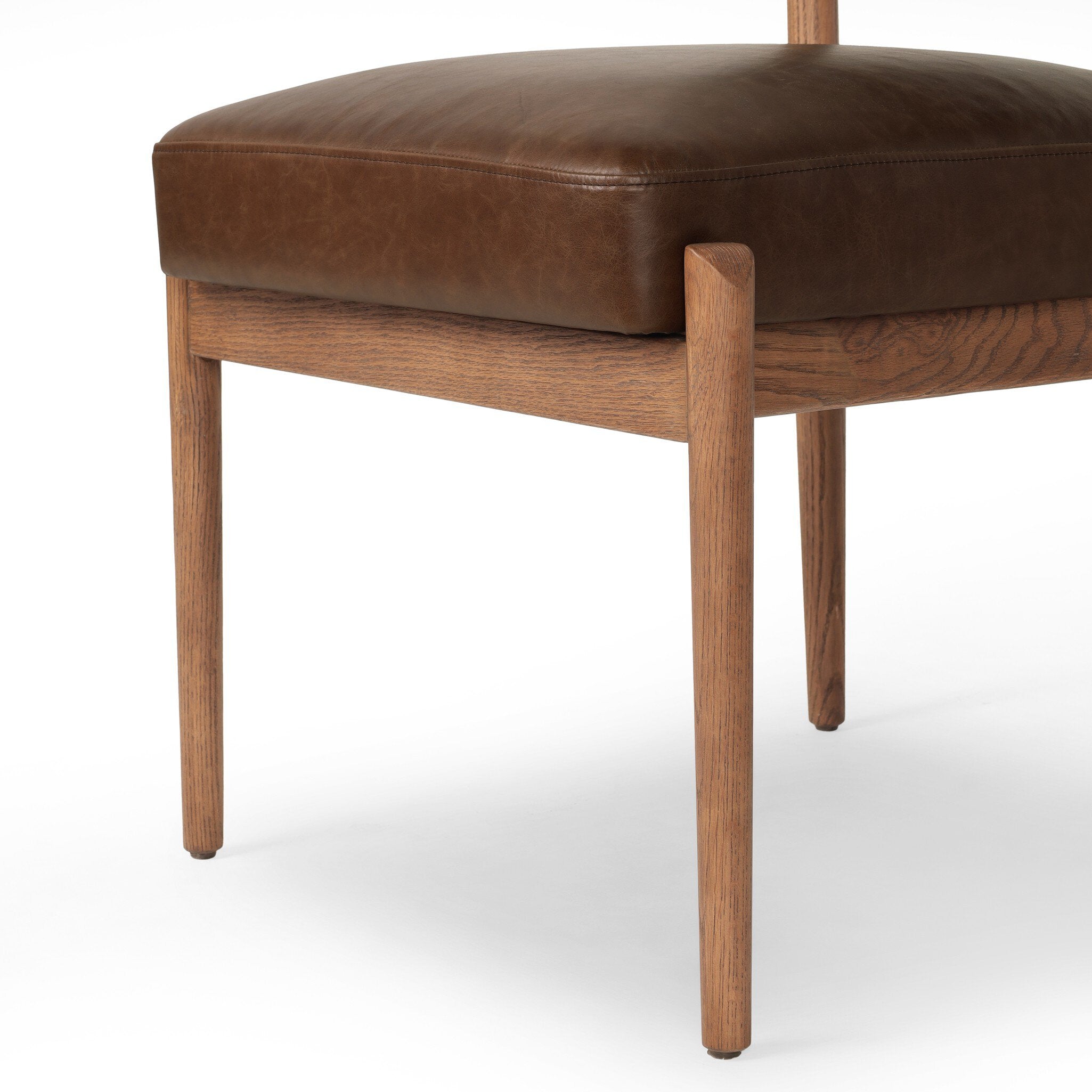 Jazelle Armless Dining Chair Shearling Bolster Back and Oak Wood Frame with Brown Leather Seating Design Idea Retro Mid Century Modern Angle View Bottom Wooden Oak Legs