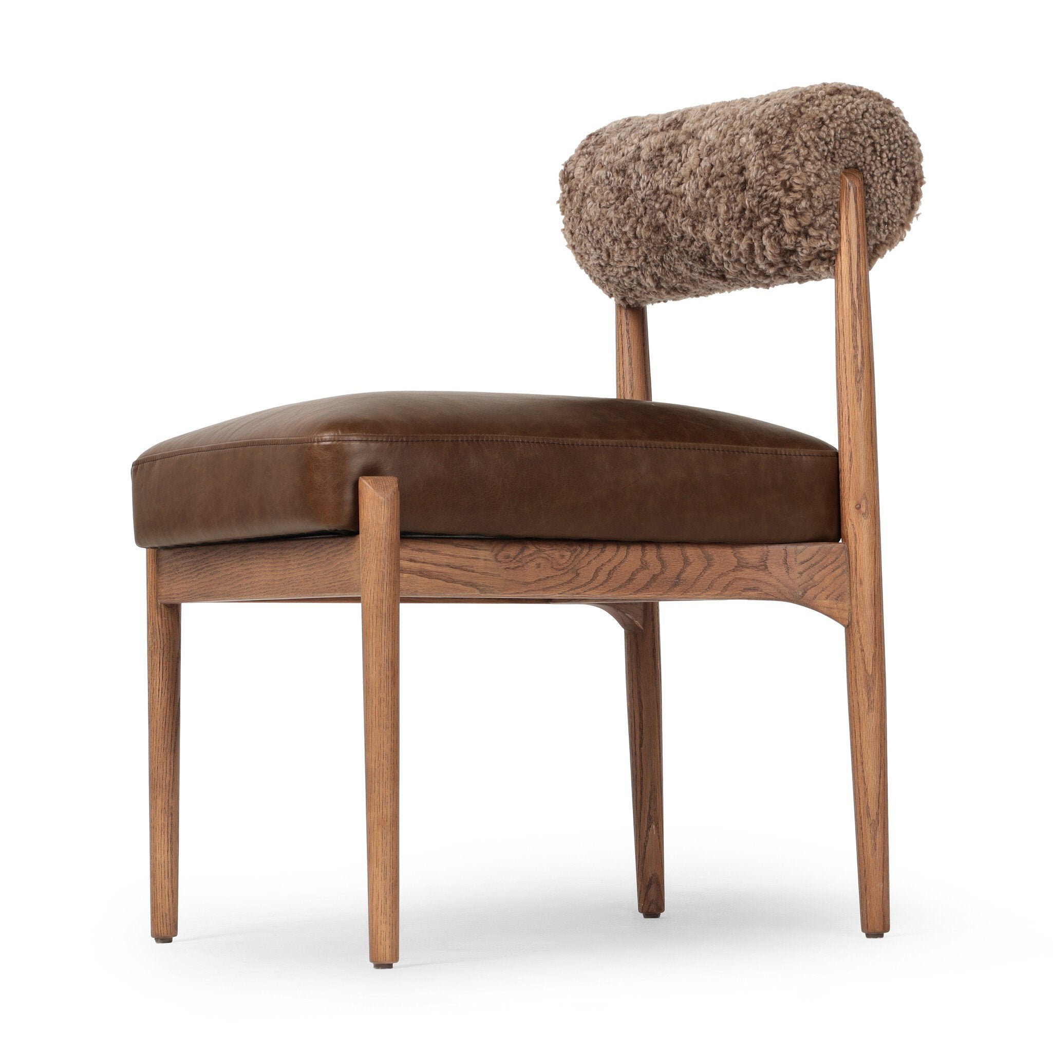 Jazelle Armless Dining Chair Shearling Bolster Back and Oak Wood Frame with Brown Leather Seating Design Idea Retro Mid Century Modern Angle View Close Detailed White Background