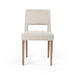 Armless dining chair with light camel upholstered seat and back, and wooden legs.