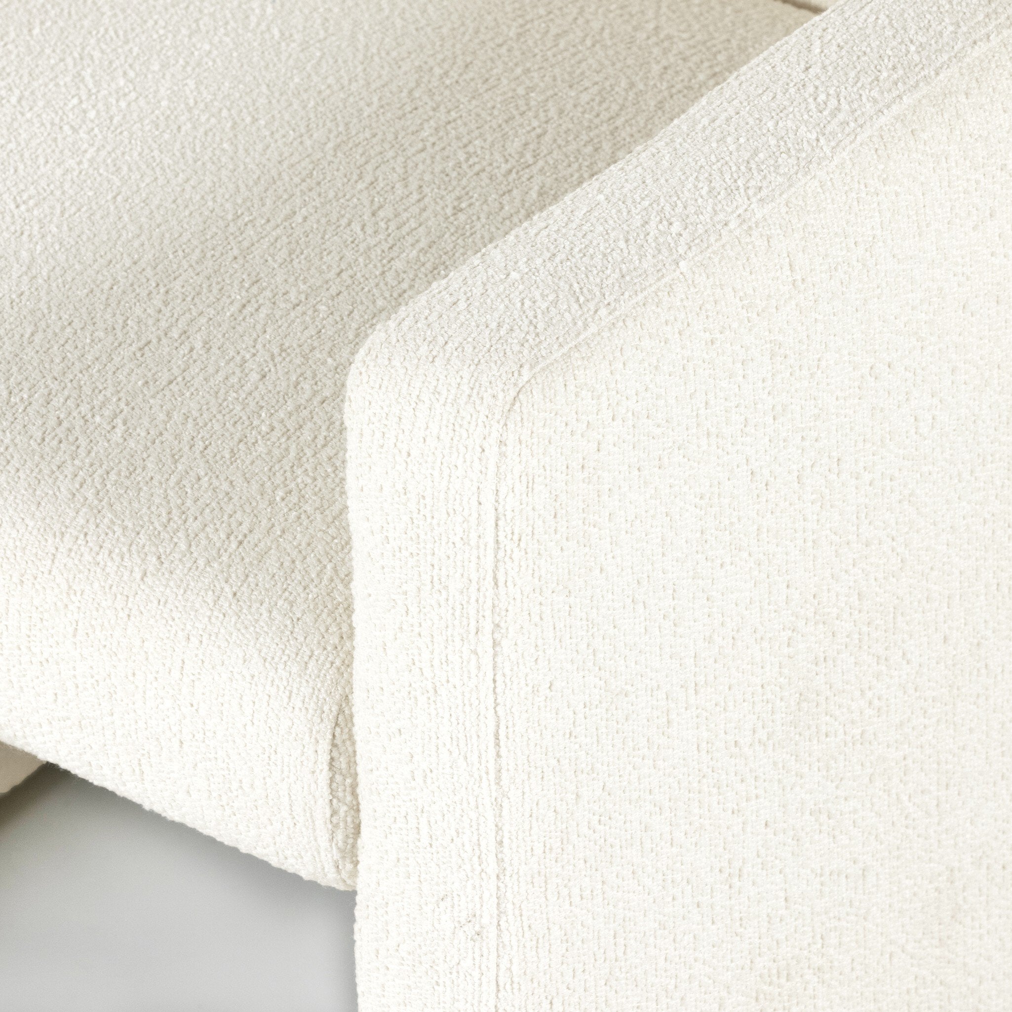 Close-up of textured white fabric Kima Dining Chair Contemporary Modern Upholstered White Armchair