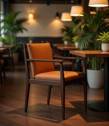 Orange leather arm chair with dark wood frame and wide padded seat