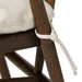 Close-up of a wooden chair with a beige cushion and white rope tie, on a white background.