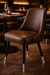 Lifestyle Harrington Club Chair by Social Design Supply Co: A modern scooped-seat lounge chair with smooth contours and contract-grade upholstery for hospitality environments