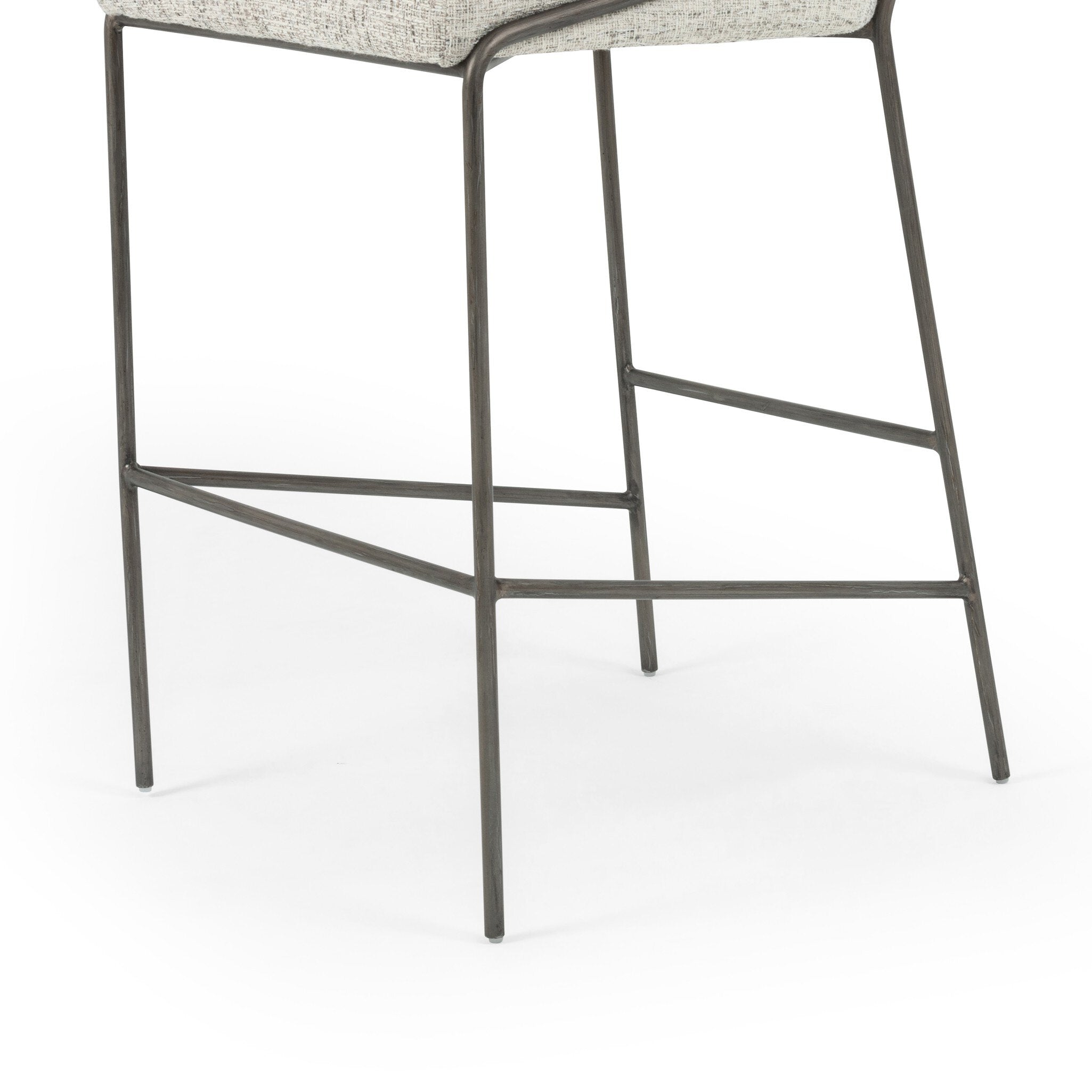 Upholstered bar stool with light fabric seat and backrest; metal frame and footrest bars