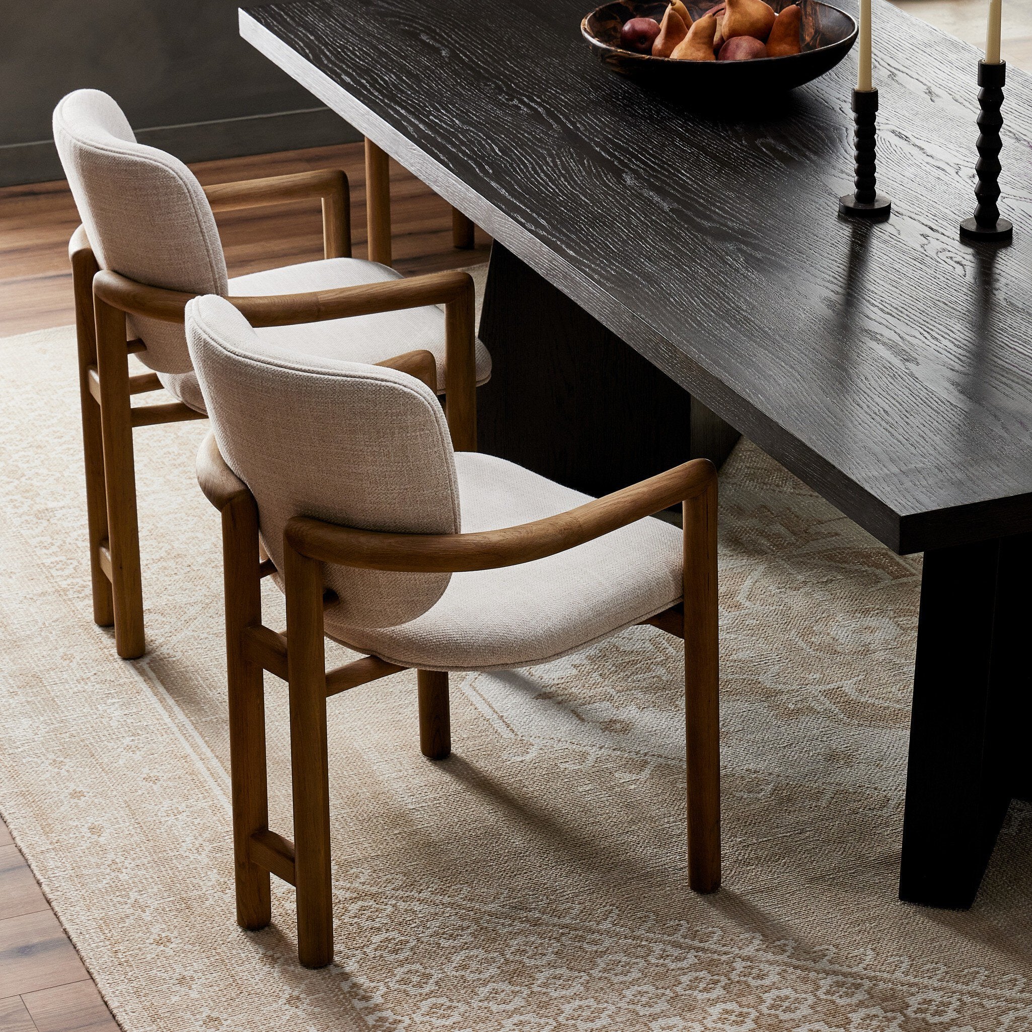 Madeira three-legged dining chair featuring a tubular frame and a curved barrel backrest in cream upholstery, showcasing its sculptural mid-century modern design 