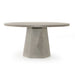 Main Outdoor Dining Table with a round white concrete top and tapered pedestal base