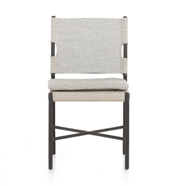 Miller outdoor performance dining chair with a light taupe fabric cushion, wrap detail, and a crossed bronze aluminum frame.