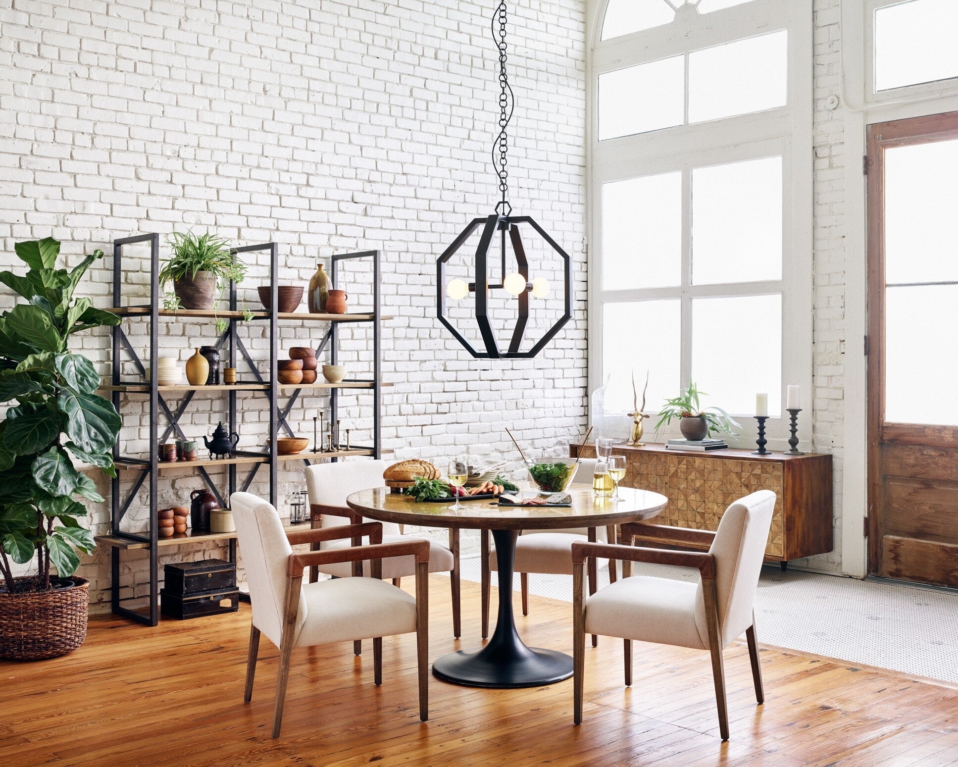 Modern dining scene Reuben Dining Chair with oak frame, leather-wrapped arms, and natural linen seat