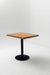 Square white oak table top on a black pedestal base