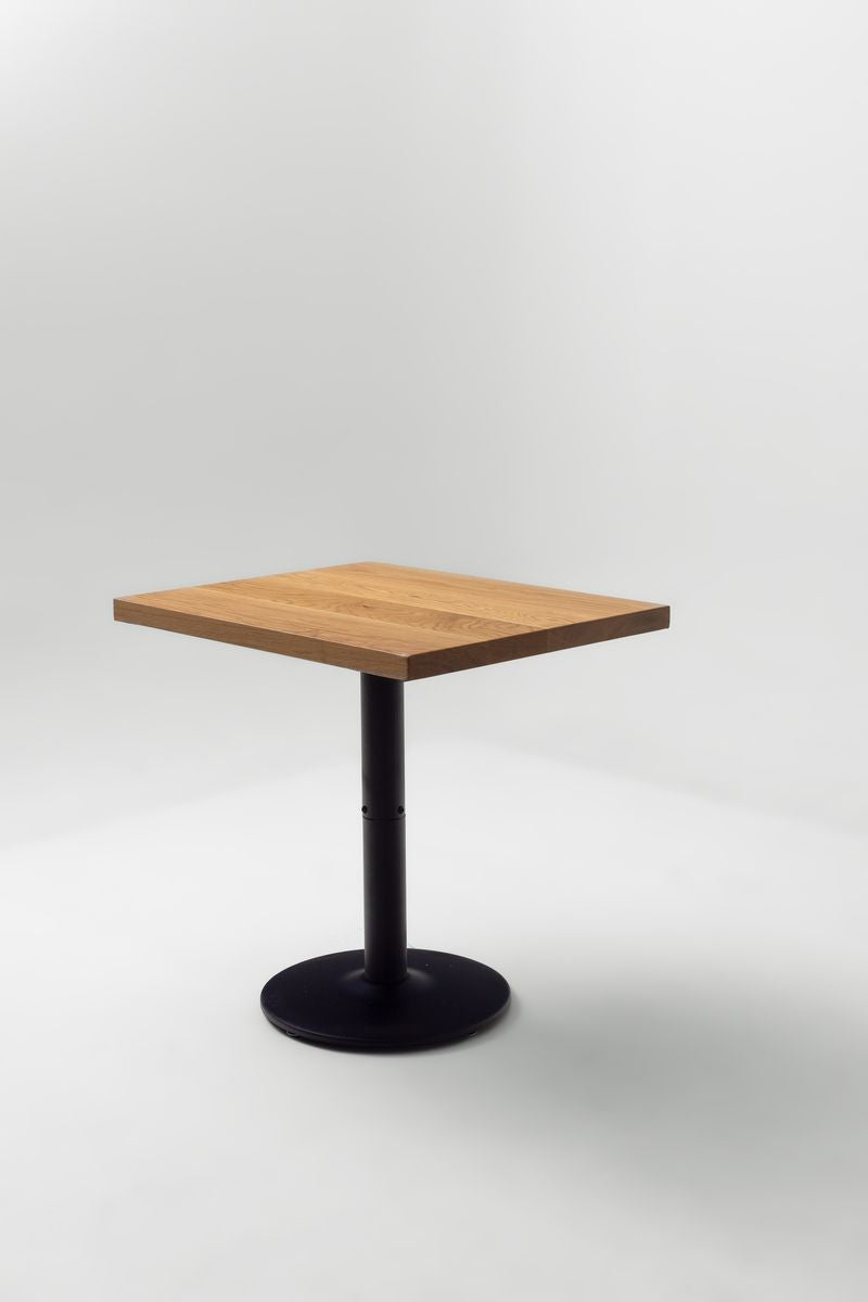 Square white oak table top on a black pedestal base