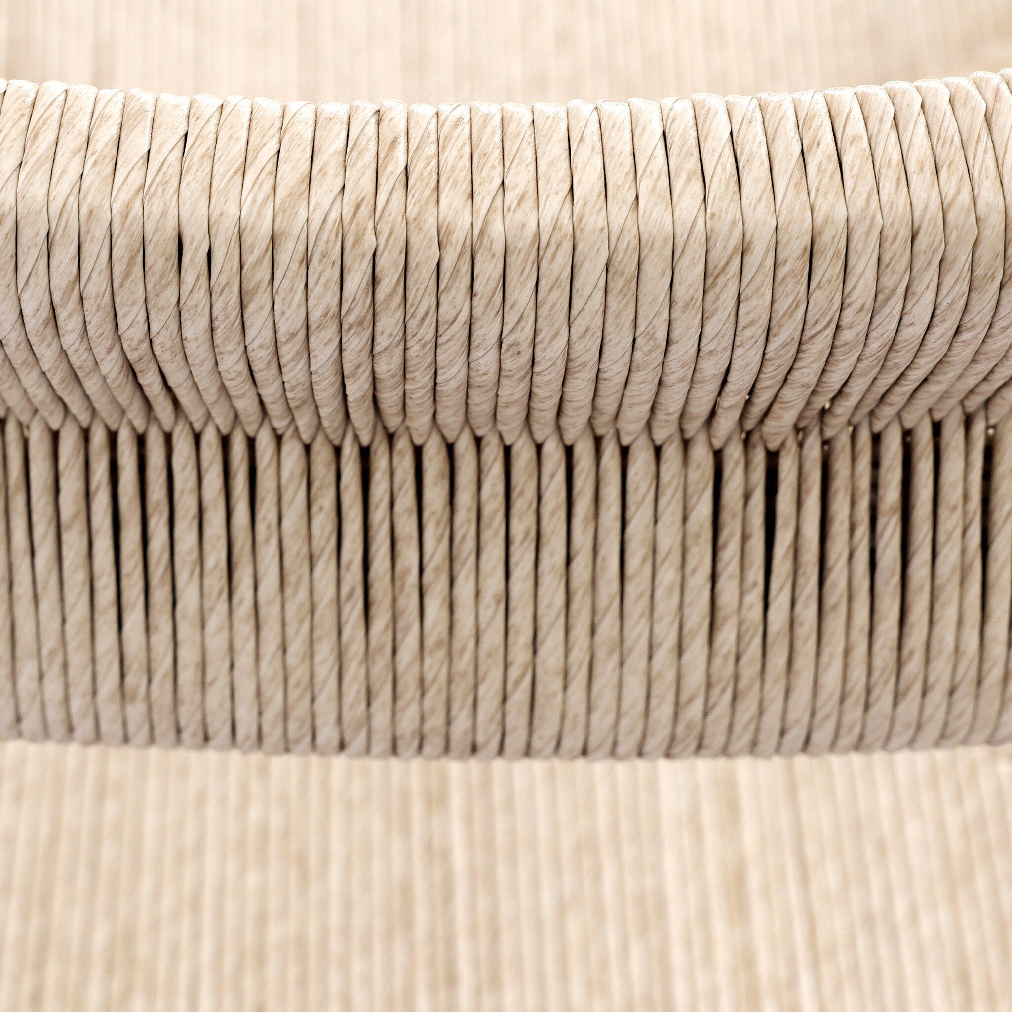 Natural Fiber Detail Lomas Outdoor Dining Armchair in Vintage White woven wicker with a tapered natural teak frame