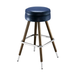 Blue upholstered bar stool with round padded seat, chrome footrest, brass legs
