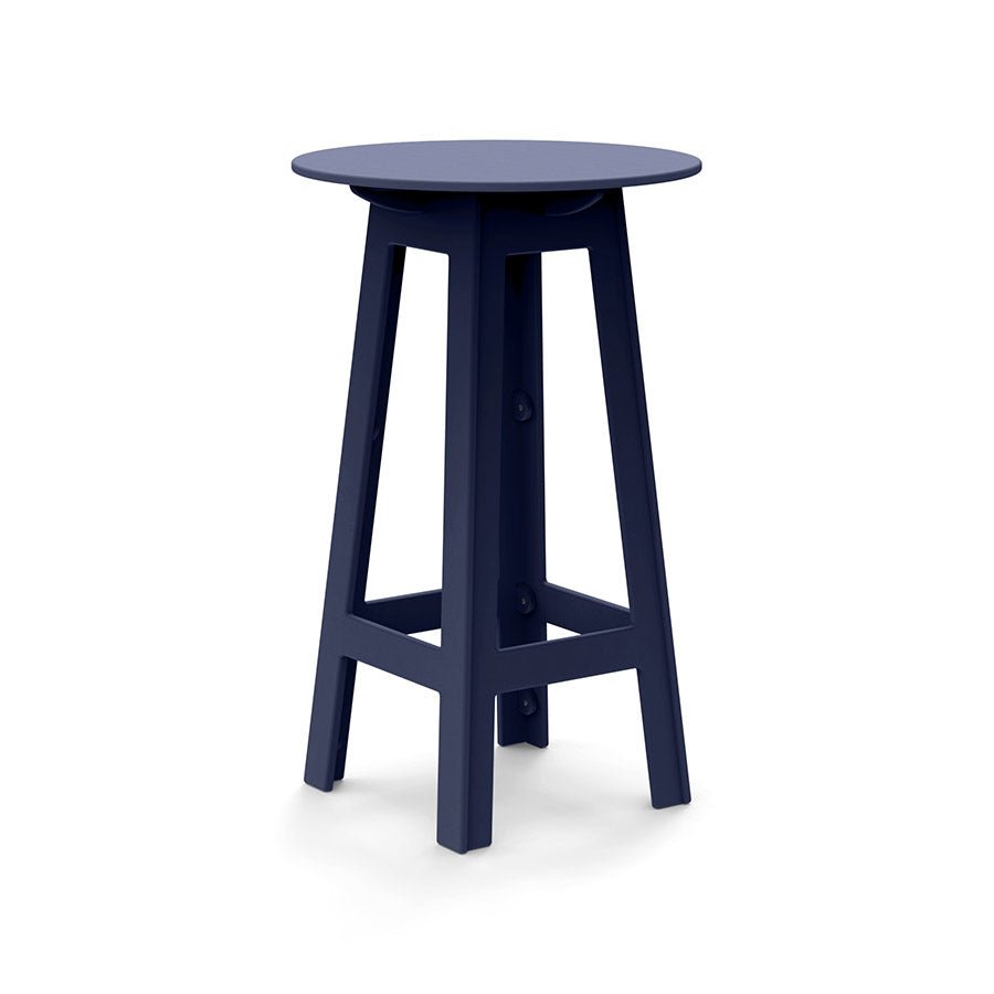 Navy round bar table with angled legs and open-frame cutouts