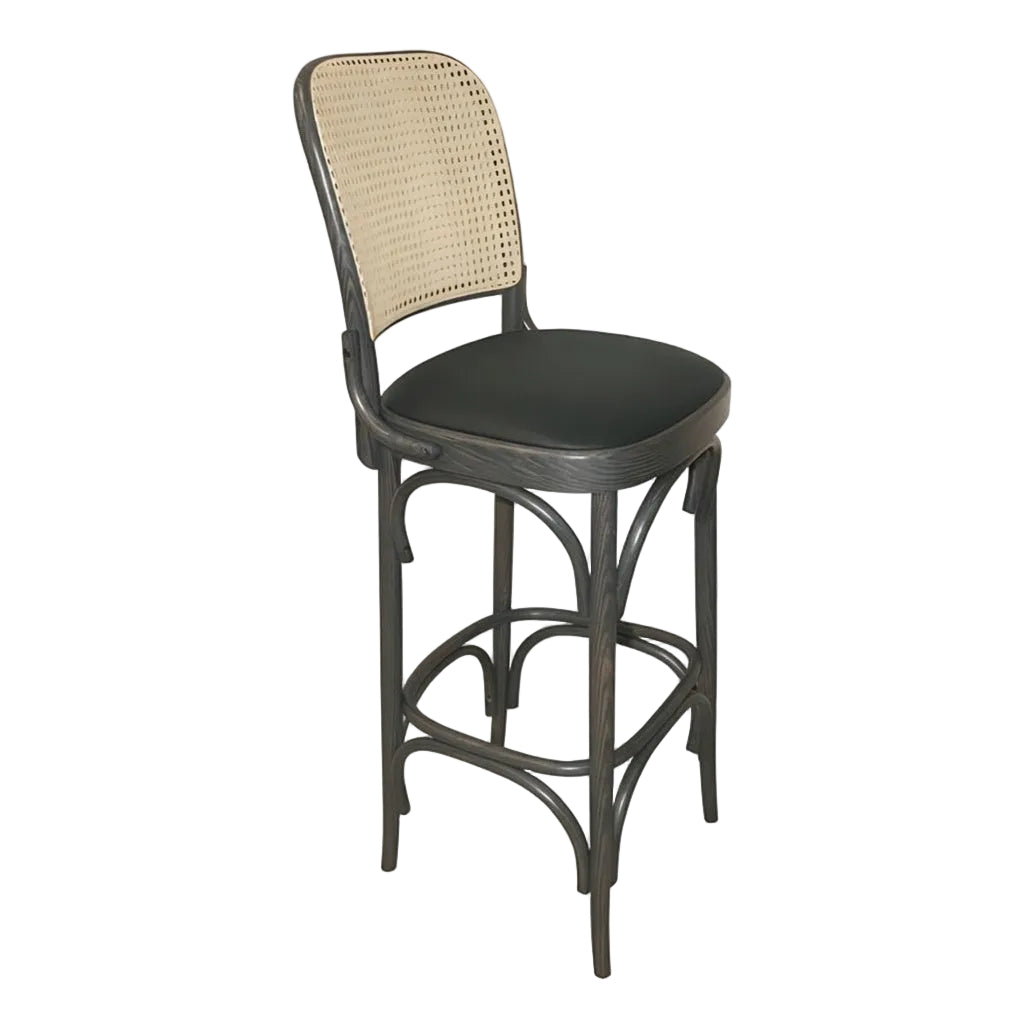 Theo bar stool angled view with beige woven back, dark round seat, and dark wood frame